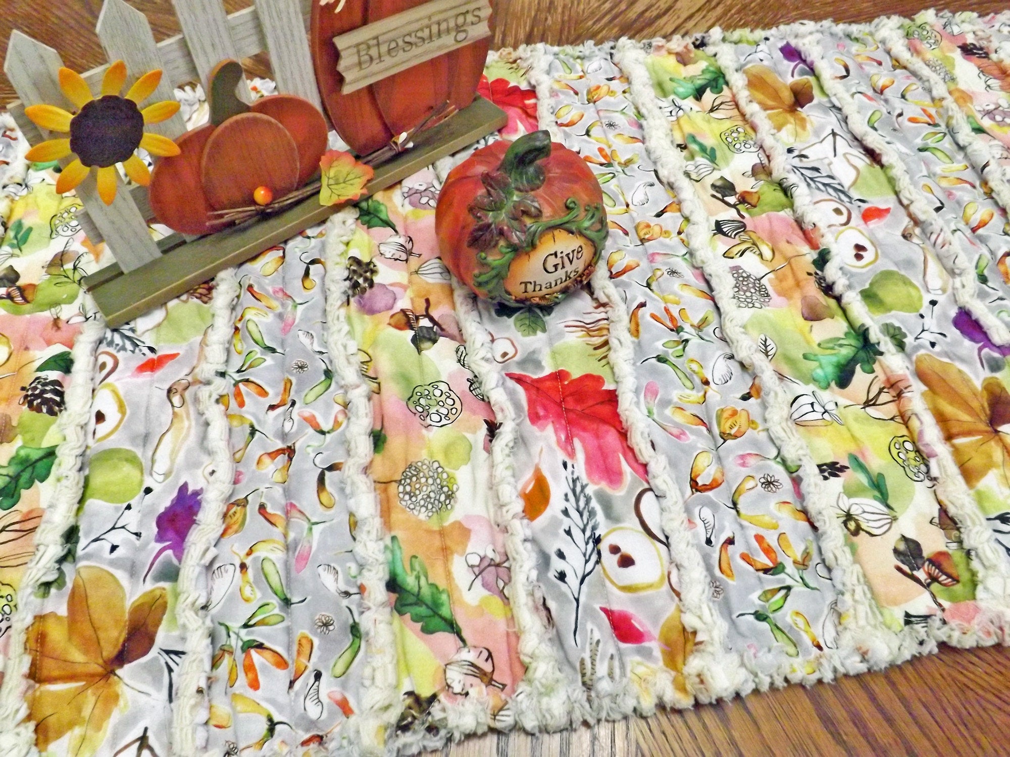 Acorns and autumn leaves rag quilt table runner with bright autumn colors